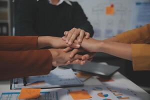 Hand join together for work togetherness, Hand stack for business and service, Team volunteering or teamwork. Concept connection of community and charity. Group of business workforce participation. photo