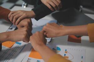 Hand join together for work togetherness, Hand stack for business and service, Team volunteering or teamwork. Concept connection of community and charity. Group of business workforce participation. photo