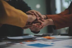 Hand join together for work togetherness, Hand stack for business and service, Team volunteering or teamwork. Concept connection of community and charity. Group of business workforce participation. photo