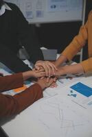Hand join together for work togetherness, Hand stack for business and service, Team volunteering or teamwork. Concept connection of community and charity. Group of business workforce participation. photo