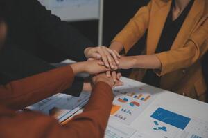 Hand join together for work togetherness, Hand stack for business and service, Team volunteering or teamwork. Concept connection of community and charity. Group of business workforce participation. photo