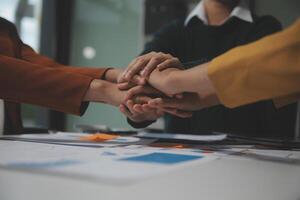 Hand join together for work togetherness, Hand stack for business and service, Team volunteering or teamwork. Concept connection of community and charity. Group of business workforce participation. photo