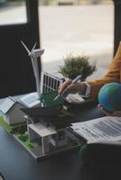 Carbon offset price report CO2 emission. Future growth Net zero waste in ESG ethical SME office protect climate change global warming social issues project. Group of asia people Eco friendly SDGs plan photo