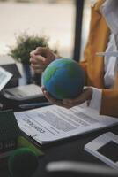 Carbon offset price report CO2 emission. Future growth Net zero waste in ESG ethical SME office protect climate change global warming social issues project. Group of asia people Eco friendly SDGs plan photo