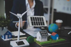 Carbon offset price report CO2 emission. Future growth Net zero waste in ESG ethical SME office protect climate change global warming social issues project. Group of asia people Eco friendly SDGs plan photo