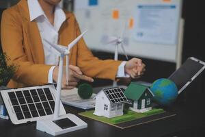 Carbon offset price report CO2 emission. Future growth Net zero waste in ESG ethical SME office protect climate change global warming social issues project. Group of asia people Eco friendly SDGs plan photo