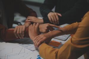 Hand join together for work togetherness, Hand stack for business and service, Team volunteering or teamwork. Concept connection of community and charity. Group of business workforce participation. photo