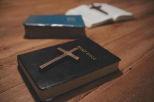 Christian group are praying to god with the bible and sharing the gospel. Concept of faith for god. photo