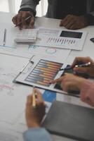 Close up of Business team analyzing income charts and graphs with modern laptop computer. Business analysis and strategy concept. photo