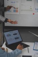 Close up of Business team analyzing income charts and graphs with modern laptop computer. Business analysis and strategy concept. photo
