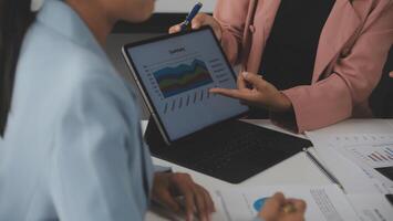 Close up of Business team analyzing income charts and graphs with modern laptop computer. Business analysis and strategy concept. photo