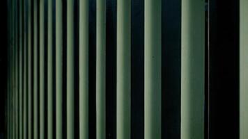 Close up of a green metal blinds on a building wall for design background. photo