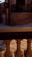 A close up of a railing with a brick building in the background video