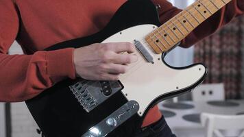 A man plays the guitar. Close-up of the hands. Strings. video