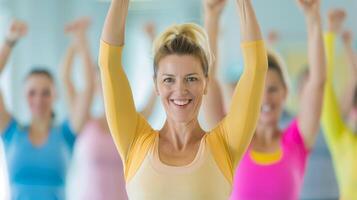 Enthusiastic Group Fitness Class Participants in Bright Attire, Smiling Women Exercising with Raised Arms, Indoor Aerobics Session, Healthy Lifestyle Concept, Positive Energy and Team Spirit photo