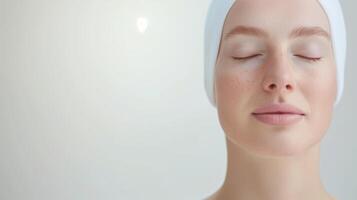 Close-Up Portrait of a Serene Woman after Spa with Closed Eyes and Relaxed Expression Wearing a White Headband on a Light Grey Background - Ideal for Mindfulness, Wellness, and Beauty Concepts photo