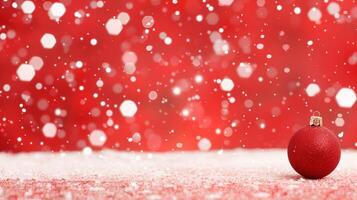 Festive Red Christmas Background With Bokeh Lights and Red Ornament In Snow for Holiday Card Design and Seasonal Decorations photo