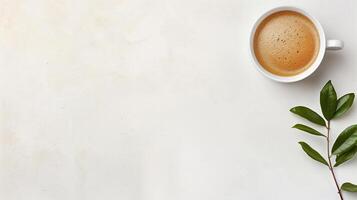 Top view of a cup of coffee and a leaf on a white background photo