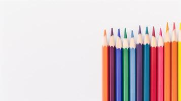 Row of Colorful Pencils Aligned on White Background for School Supplies and Creative Art Concepts with Copy Space for Text Design photo