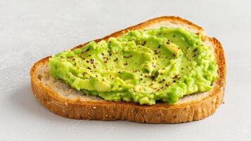 Fresh Avocado Toast On Whole Wheat Bread With Seasoning On Light Background Perfect For Breakfast Or Brunch Healthy And Delicious Meal Option With Smashed Avocado Garnished With Red Pepper Flakes photo