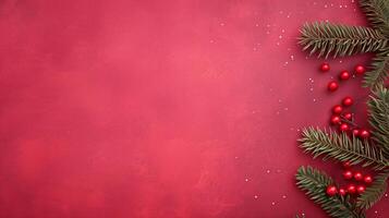 Festive Christmas Background with Red Berries and Pine Branches on Textured Red Surface photo
