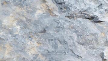 Photorealistic Close Up Texture of Rough Grey Stone Surface with Subtle Yellow and Blue Tones Highlighting Rock Details for Background or Design Use photo