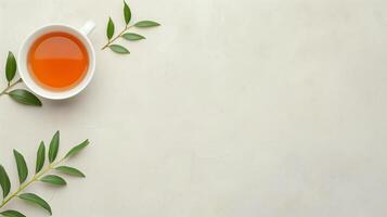 Minimalistic Top View of White Tea Cup with Green Tea Leaves on a Light Background for Health and Wellness, Spa, Relaxation, Nature Themes, and Organic Product Advertisement with Copy Space photo