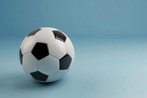 A classic black and white soccer ball resting on a soft blue background photo