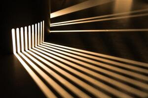 Rays of light are refracted on a black background. Background with a place for text in a stylish and modern concept for advertising phones, perfumes, appliances. photo