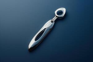 Elegant silver bottle opener on a dark background featuring a modern design photo