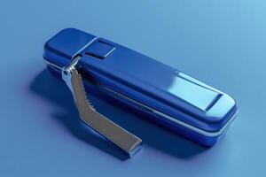 Blue stapler resting on a smooth blue surface against a minimalist backdrop photo