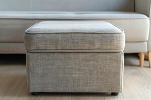 Modern upholstered ottoman in a cozy living room with a light-colored couch photo