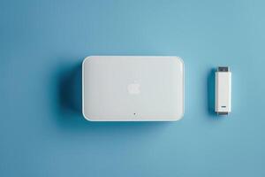 Compact white gadget and accessory on a blue background photo