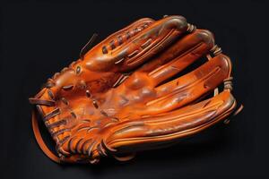 Vintage leather baseball glove resting on a black surface photo