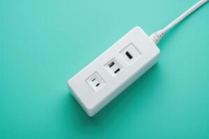 White power strip with USB ports on a teal background photo