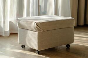 Cozy beige ottoman on wheels in sunlit living room with sheer curtains photo