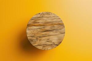 Round wooden table on a bright yellow background photo