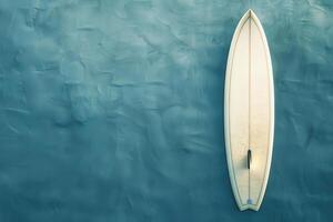 Surfer's board resting on calm ocean water at dawn photo