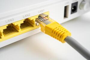Ethernet cable with wireless router connect to internet service provider internet network. photo