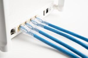 Ethernet cable with wireless router connect to internet service provider internet network. photo
