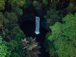 Waterfall in rain forest. Aerial drone view of Tibumana waterfall photo