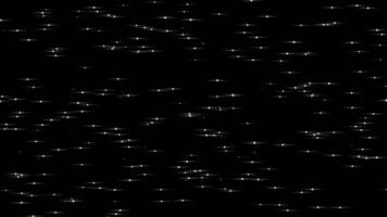 White color tiny small glowing and flickering particles slowly moving on black background video