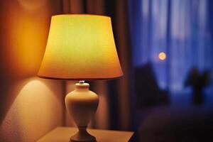 Warmly lit lamp creating a cozy atmosphere in a softly lit living room photo