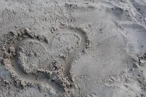 Character heart painted on the sand of Valentine's Day prazdink on open-piece copyspace photo