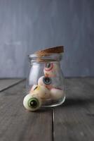Eyes in a jar. Funny and scary candies in the form of eyes. Preparing for Halloween photo