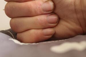 Hand close-up. Close-up fingers on a background with space for copyspace text photo