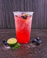 Blueberry Mojitos Lemonade Fizz served in glass isolated on background side view of healthy and delicious beverage photo