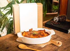 Lasagna Frozen Preparation Kit with fork served in dish isolated on table side view of taiwan baked food photo
