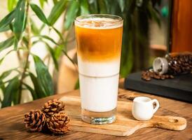Iced Latte served in glass isolated on table side view of taiwan drink photo