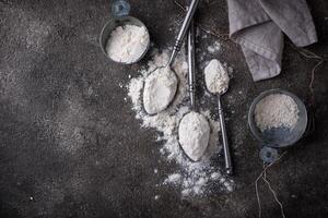 Wheat flour on dark. Baking background photo